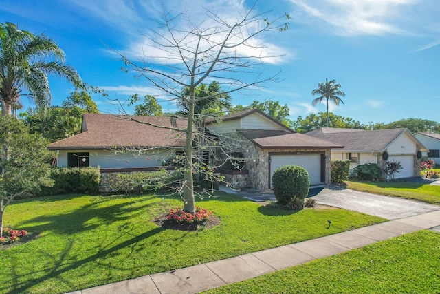 single story home featuring a garage and a front lawn