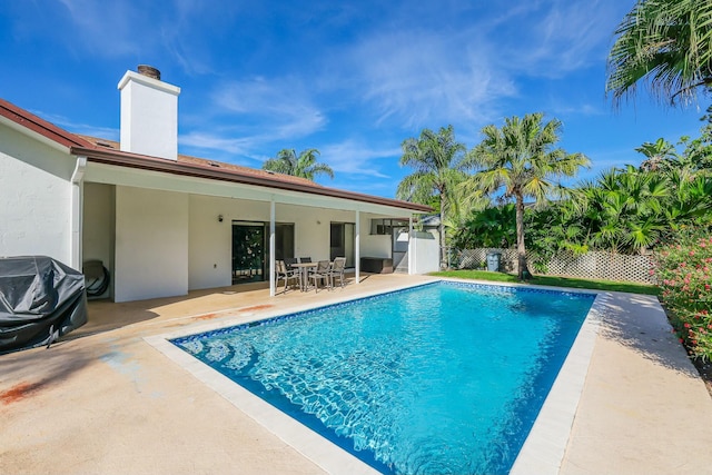 view of swimming pool featuring a patio area