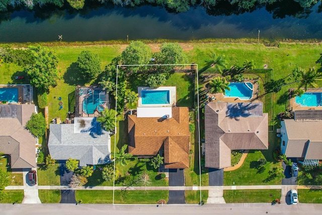 birds eye view of property featuring a water view