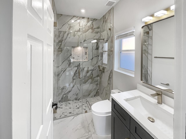 bathroom with vanity, toilet, and an enclosed shower