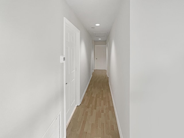 hall with light hardwood / wood-style floors