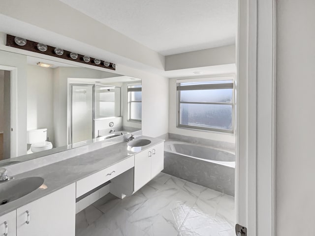 full bathroom featuring plus walk in shower, a textured ceiling, vanity, and toilet