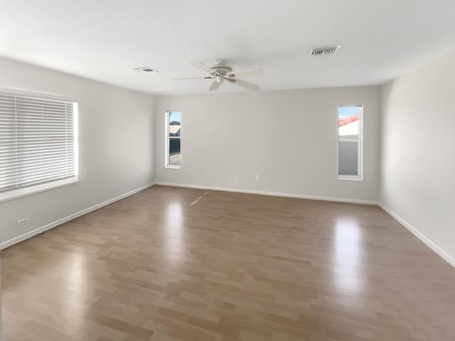 empty room featuring ceiling fan and wood-type flooring