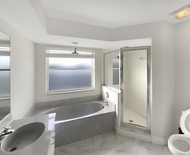 bathroom with shower with separate bathtub and vanity