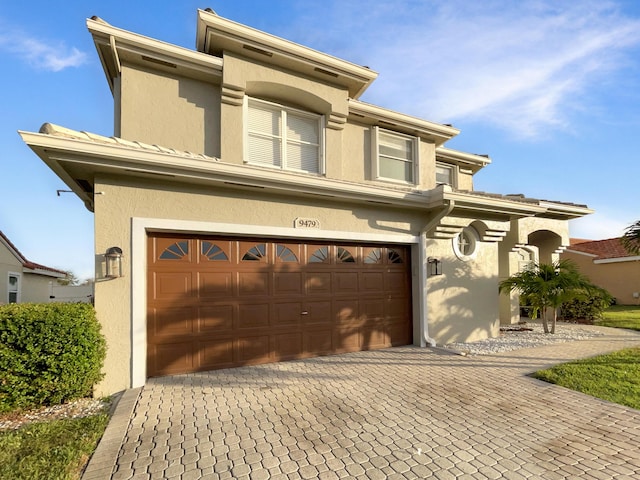 view of front of property with a garage