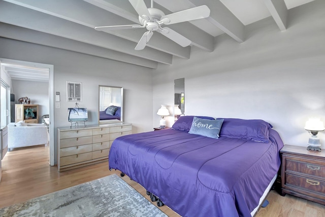 bedroom with beam ceiling, ceiling fan, and light wood-type flooring