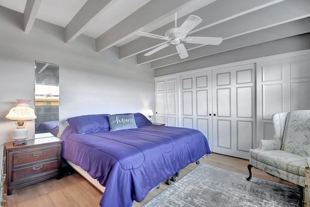 bedroom with beamed ceiling, light hardwood / wood-style flooring, and ceiling fan