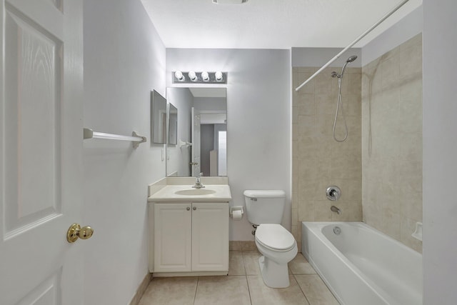 full bathroom with tile patterned floors, toilet, vanity, and tiled shower / bath