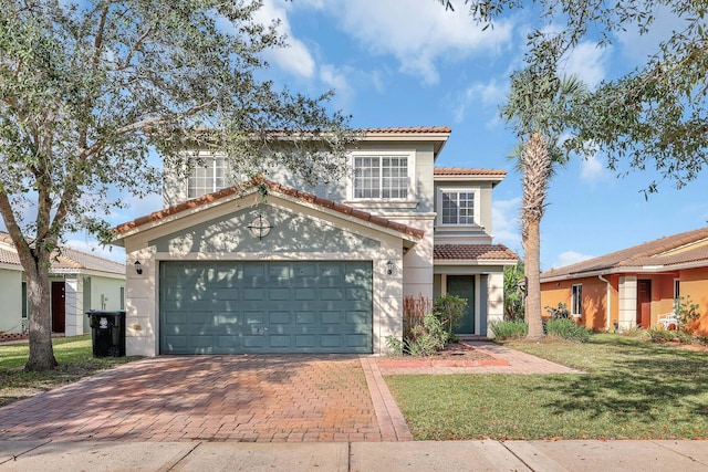 mediterranean / spanish-style home with a front yard