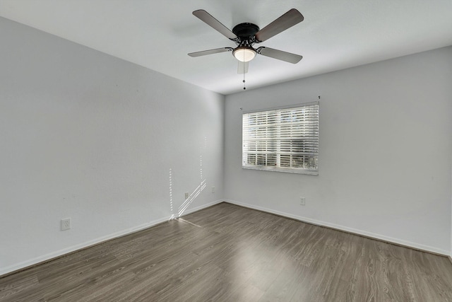 unfurnished room with hardwood / wood-style floors and ceiling fan