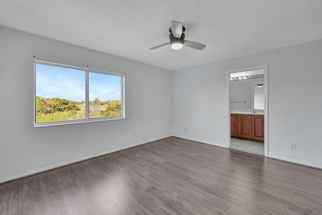 unfurnished room featuring ceiling fan and light hardwood / wood-style flooring