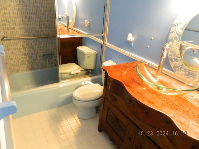 full bathroom featuring tile patterned floors, toilet, vanity, and tiled shower / bath