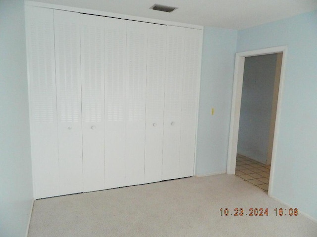 unfurnished bedroom with a closet