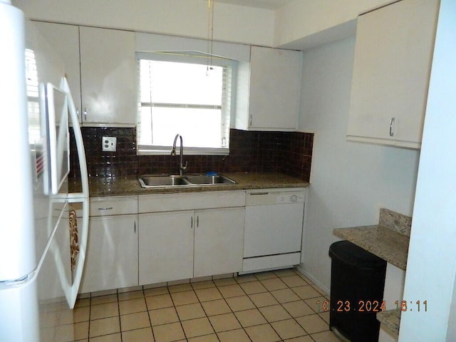 kitchen with white cabinets, decorative backsplash, white appliances, and sink