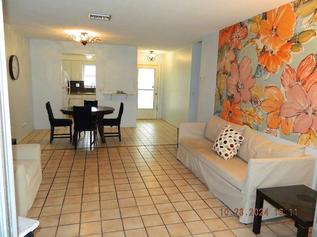 living room with sink and light tile patterned flooring