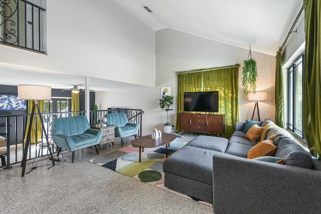 living room featuring ceiling fan and lofted ceiling