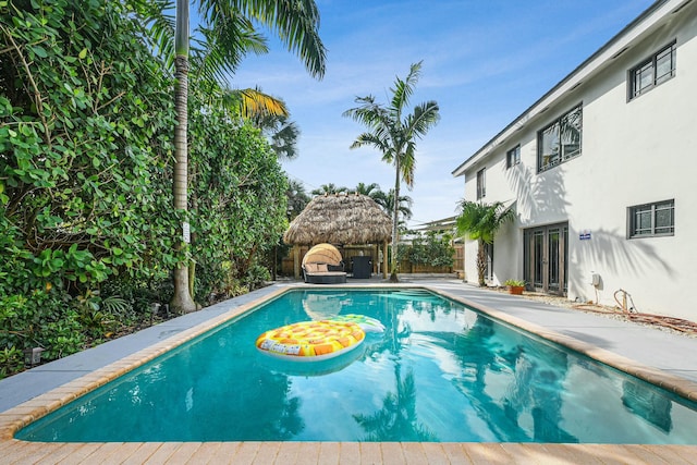 view of pool featuring french doors