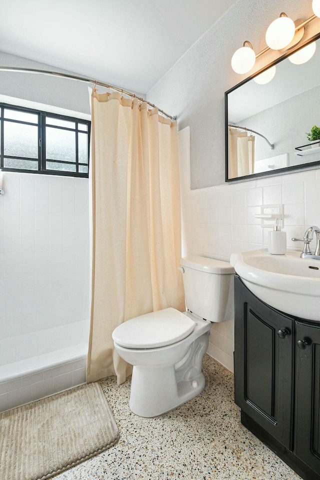 bathroom featuring curtained shower, decorative backsplash, vanity, and toilet