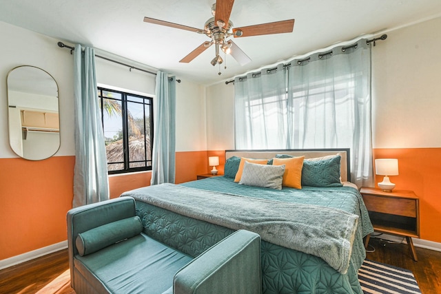 bedroom with ceiling fan and hardwood / wood-style flooring