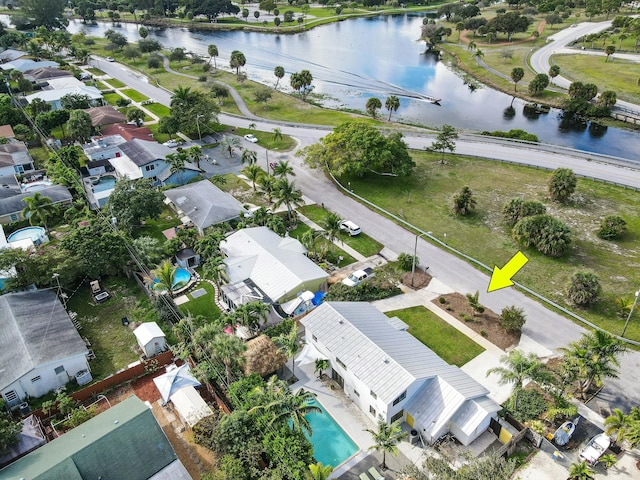 birds eye view of property featuring a water view