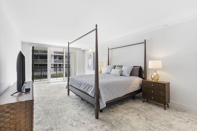 bedroom with access to outside and expansive windows