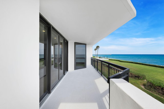 balcony featuring a water view