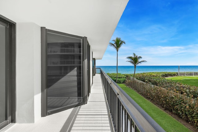 balcony featuring a water view