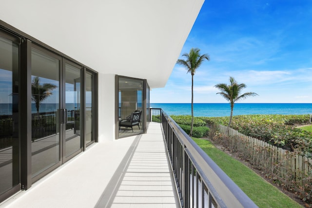 balcony featuring a water view