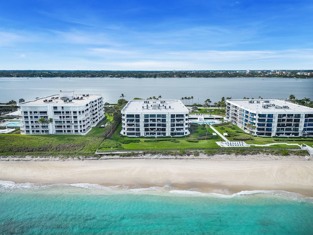 aerial view with a view of the beach and a water view