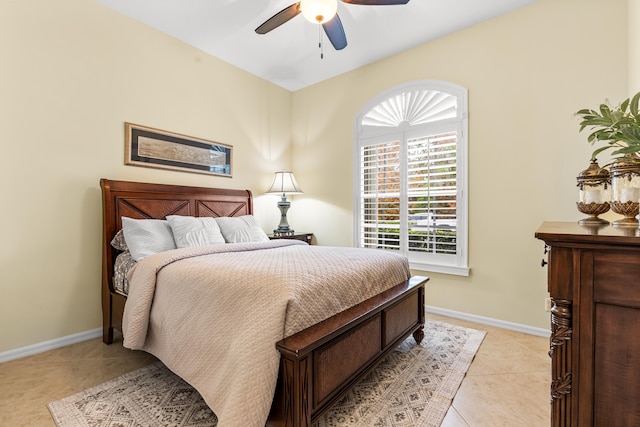 tiled bedroom with ceiling fan