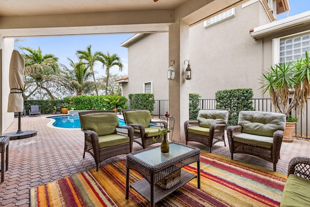 view of patio with a fenced in pool and an outdoor living space