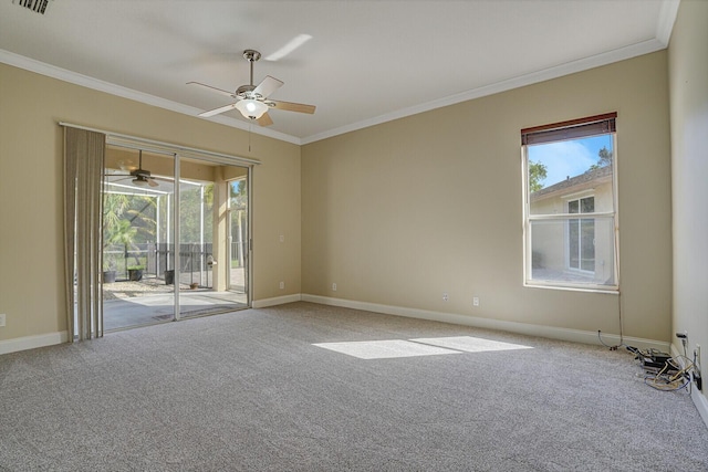 carpeted spare room with ceiling fan and ornamental molding