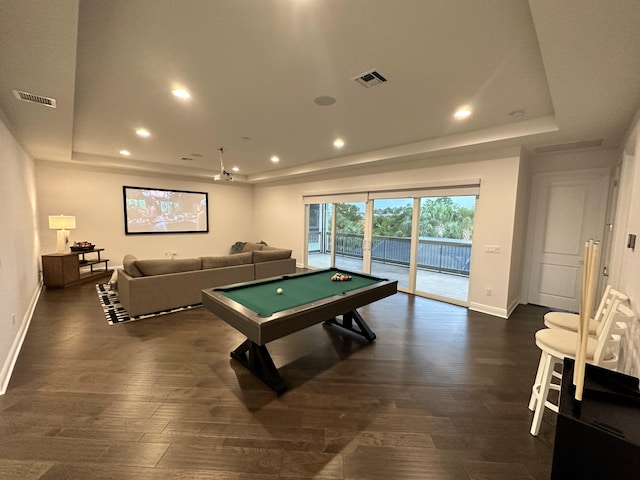 game room with a tray ceiling, dark hardwood / wood-style floors, and pool table