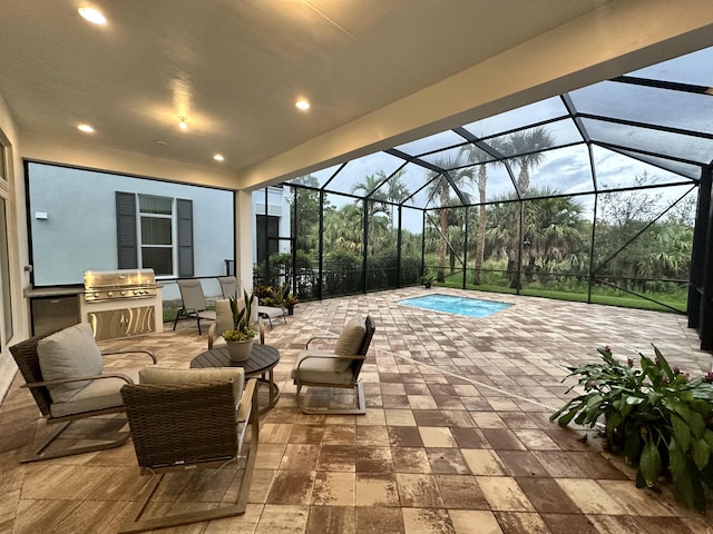 view of patio featuring a jacuzzi, area for grilling, and glass enclosure