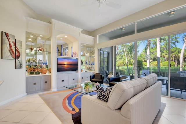 tiled living room featuring ceiling fan