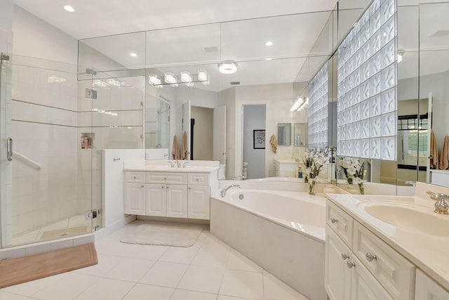 bathroom featuring separate shower and tub, tile patterned flooring, and vanity