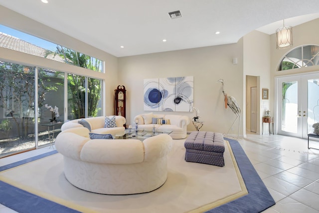 tiled living room featuring french doors