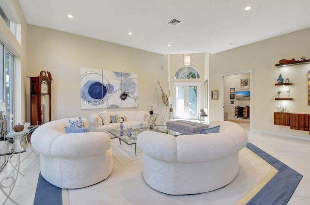 living room with french doors and light tile patterned flooring