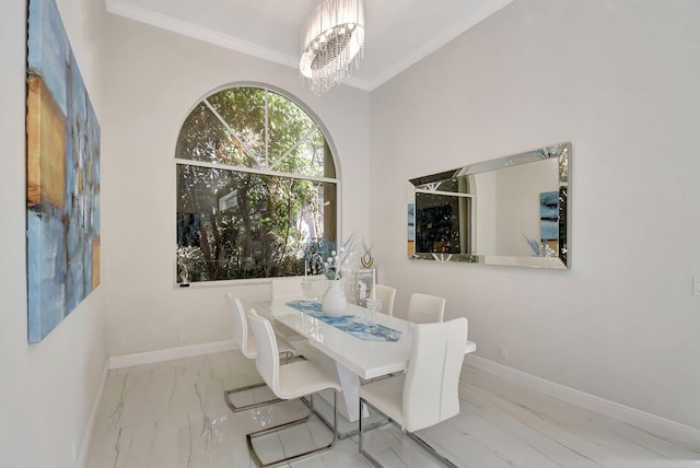 dining room with crown molding and an inviting chandelier