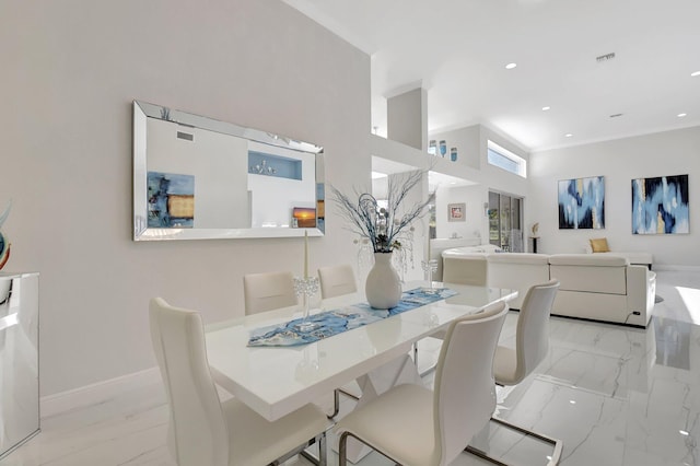 dining space with a high ceiling