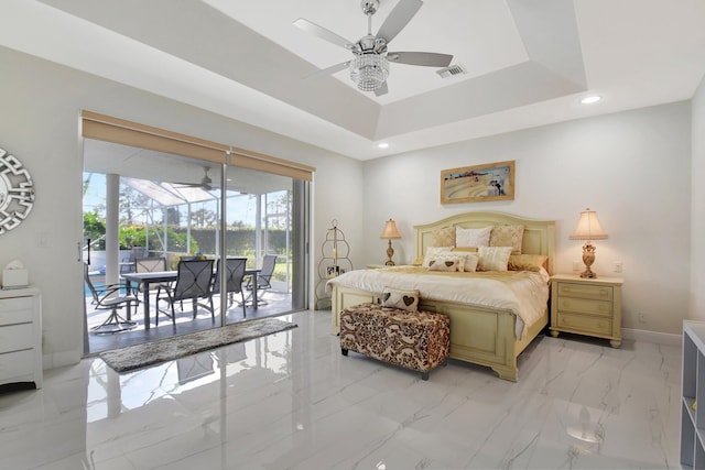 bedroom with a raised ceiling, ceiling fan, and access to exterior