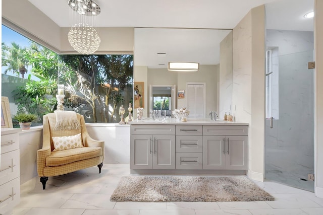 bathroom with a shower with door, vanity, and a notable chandelier