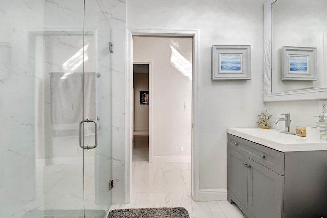 bathroom with vanity and a shower with shower door