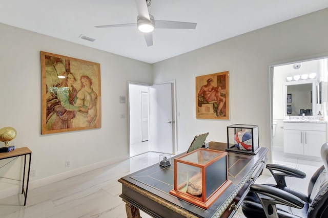 office space with ceiling fan and light hardwood / wood-style flooring