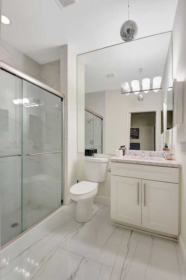 bathroom with vanity, toilet, and walk in shower