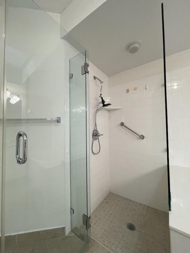 bathroom featuring an enclosed shower