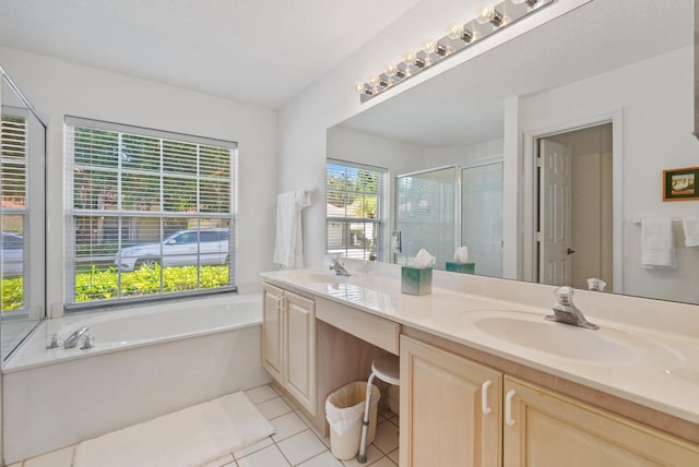 bathroom with tile patterned floors, vanity, and independent shower and bath