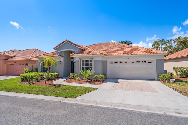 mediterranean / spanish house featuring a garage