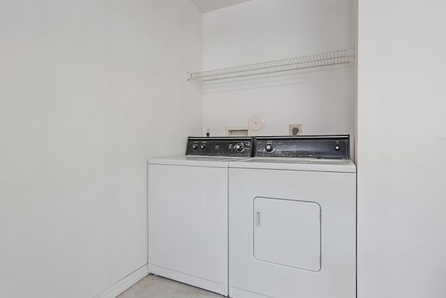 washroom featuring washer and clothes dryer