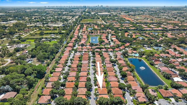 drone / aerial view with a water view